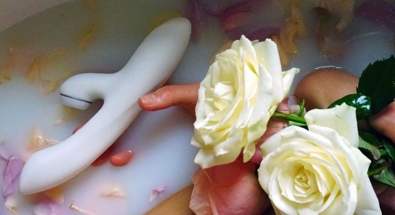 A rabbit vibrator in a bathtub with flowers