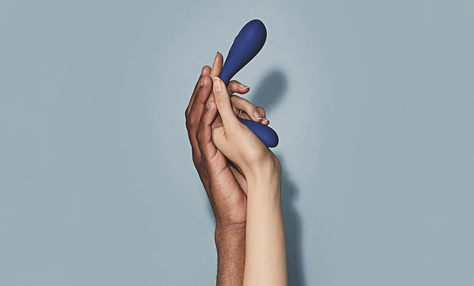 Two hands holding a vibrator